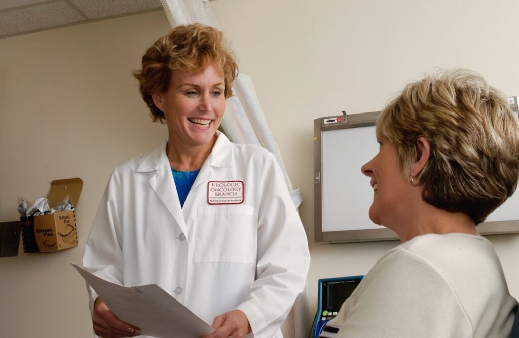 Patient discussing flu symptoms and antiviral treatment timing with a clinician